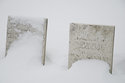 Two Tombstones Covered By Snow