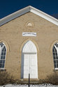 Closeup Of The White Brick Church Front And Steps