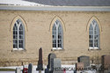 Three Windows On The Side Of White Brick Church