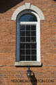 Close Up Of Window And Historic Brick